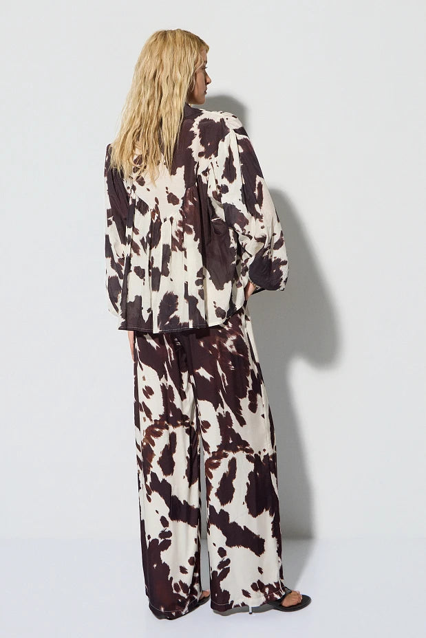 High-waisted cow print pants