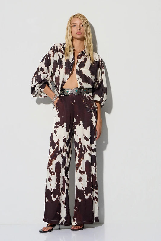 High-waisted cow print pants