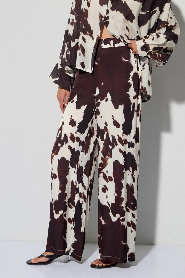 High-waisted cow print pants